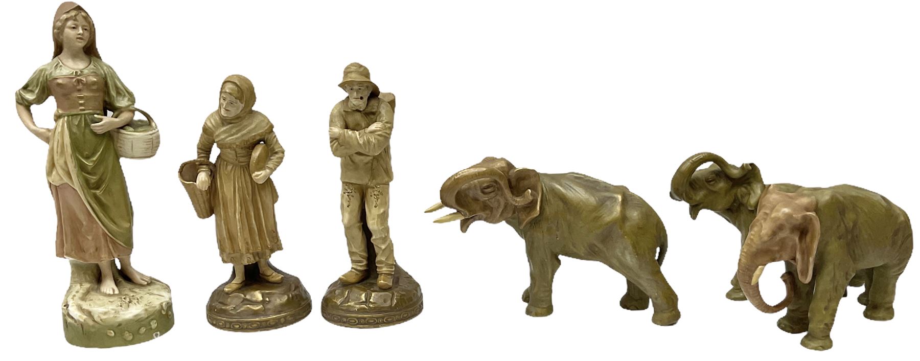 Royal Dux figure modelled as a fish seller, with applied triangle mark to the base and impressed model number 2292, H27cm, together with three Royal Dux style elephants, and a pair of Austrian Turn Wien figures, each carrying 'striker' baskets for matches. 