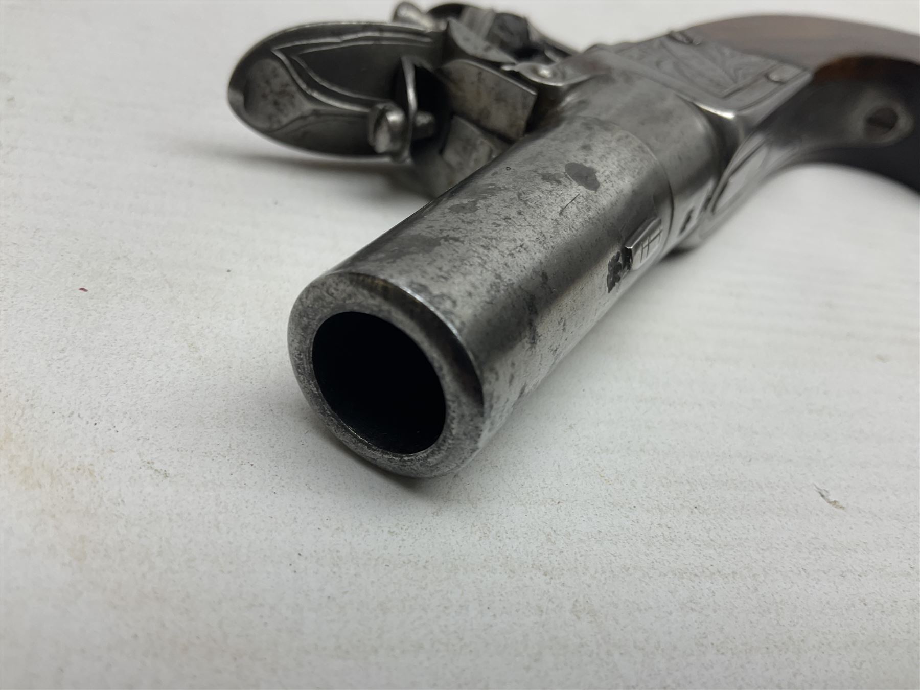 Early 19th century J. Calvert (Leeds) flintlock single barrel tap action pocket pistol, approximately .45 cal., the 4cm (originally) screw off barrel with top safety and walnut stock L16cm overall