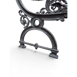 Yates Haywood - pair of 19th century cast iron bench ends, winged griffin detail, arched legs with rope turned decoration, finish in green paint, registration number 206550, first registered 8 March 1867 (see illustration), length as required