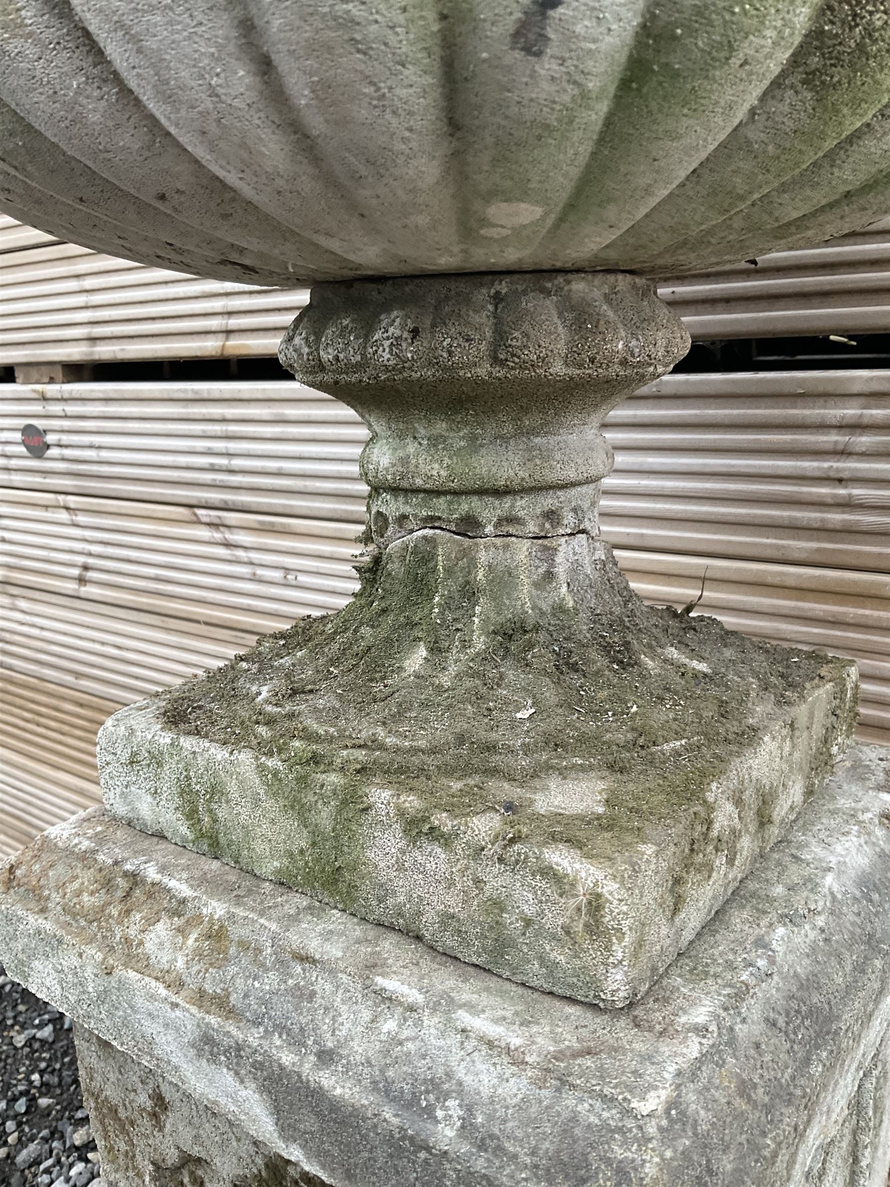 Cast stone urn on plinth, on tall square plinth - THIS LOT IS TO BE COLLECTED BY APPOINTMENT FROM DUGGLEBY STORAGE, GREAT HILL, EASTFIELD, SCARBOROUGH, YO11 3TX