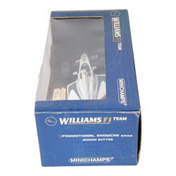 Three signed limited edition 1:18 scale Formula One models, comprising Hot Wheels Jordan EJ12 signed by Takuma Sato, Hot Wheels Jaguar Racing R2 signed by Eddie Irvine and a Minichamps Williams F1 Team model signed by Jenson Button, 1:18 scale model, all boxed