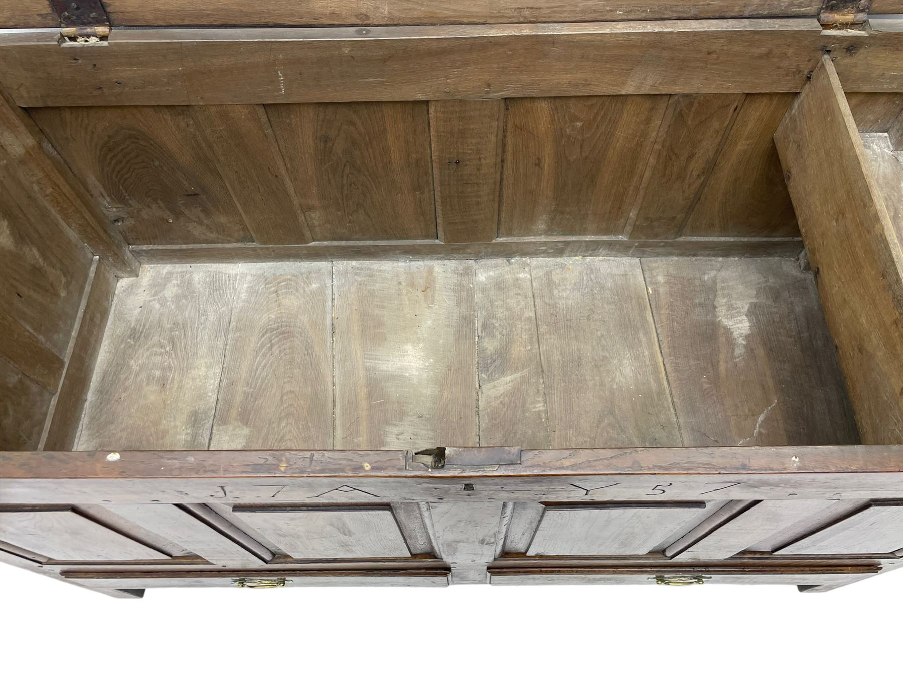 Georgian oak mule chest, moulded rectangular hinged lid over quadruple fielded panel front, the frieze inscribed '17 A Y 57', fitted with two drawers, panelled ends and back, on stile supports