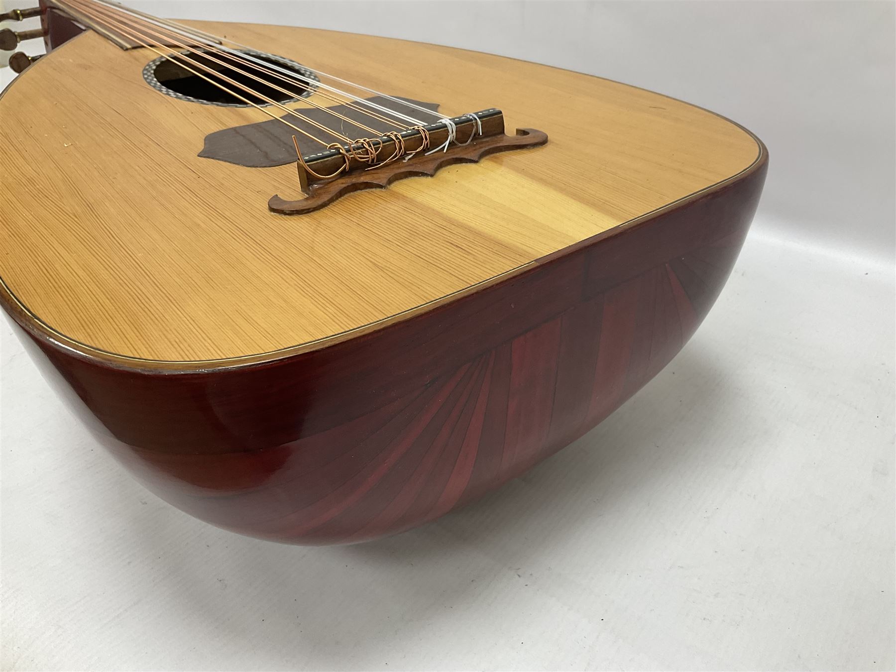 20th century Middle Eastern six string lute with a segmented back and a purpose designed hardwood stand