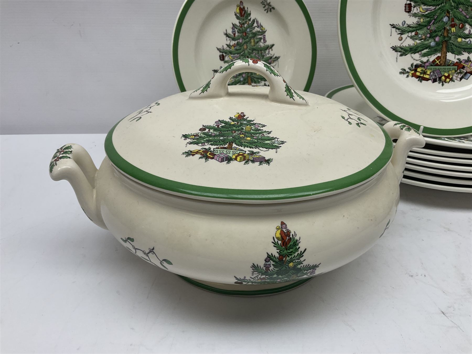 Collection of Spode Christmas Tree pattern part dinner service, comprising three covered tureens, eight dinner plates, eight side plates, eight dessert plates, sauce boat and saucer and serving platter (30)