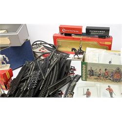 Fifty modern lead figures of mounted and foot soldiers, various period uniforms from 18th century to WW2, painted and unfinished with related paperwork; small quantity of Hornby '00' gauge model railway items and track; and four boxed Subbuteo teams etc
