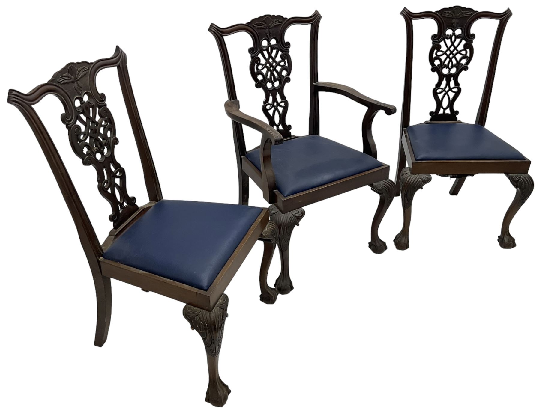 Set of six (5+1) Chippendale design mahogany dining chairs, shaped cresting rail over pierced splat with elaborately carved foliate and scrolling decoration, over drop-in upholstered seats, raised on cabriole supports with scrolled acanthus carved knees and ball and claw carved terminals