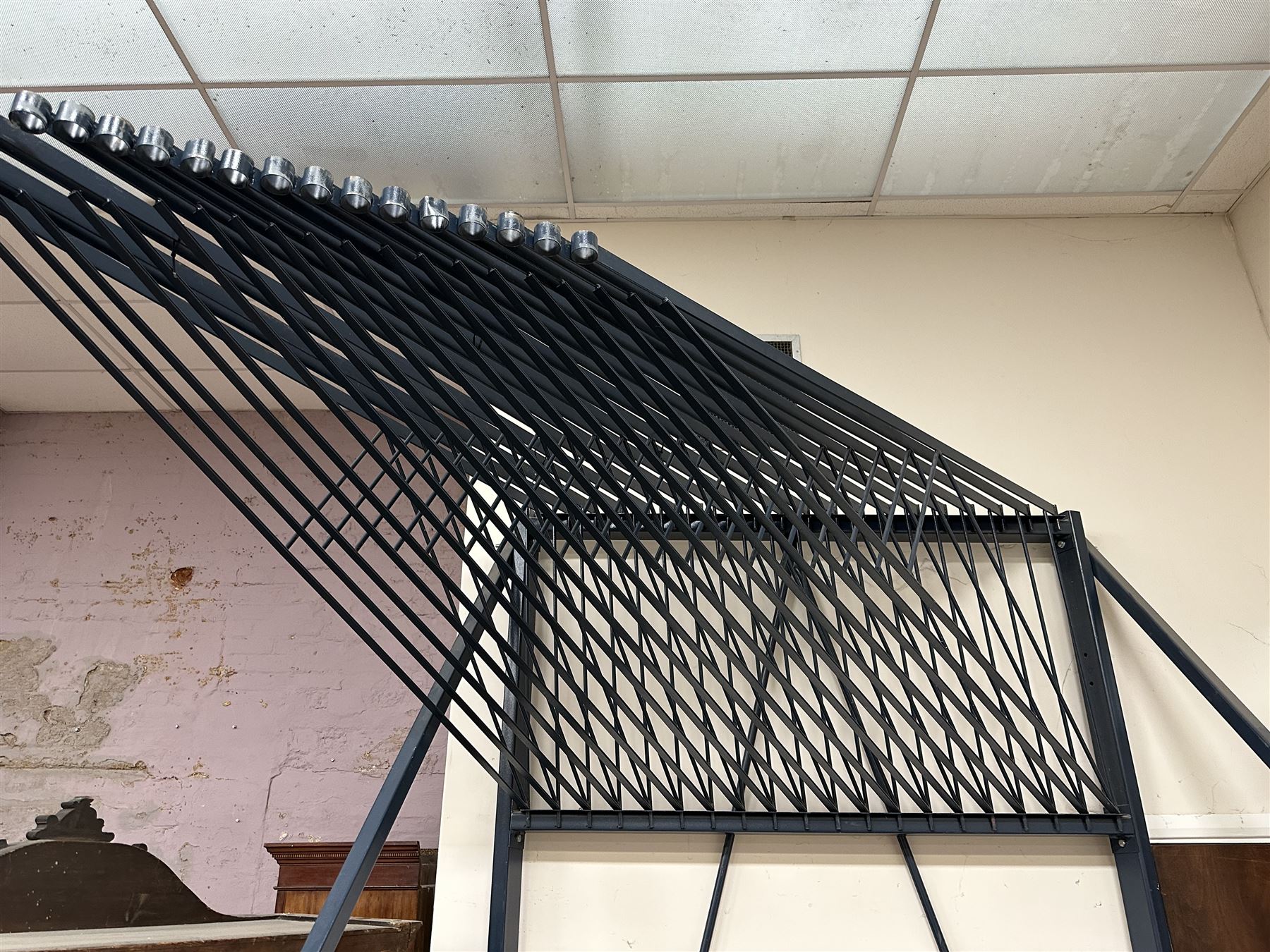 Commercial Rug Display Rack, painted steel, 20 swing arms, can fit 40 rugs back to back