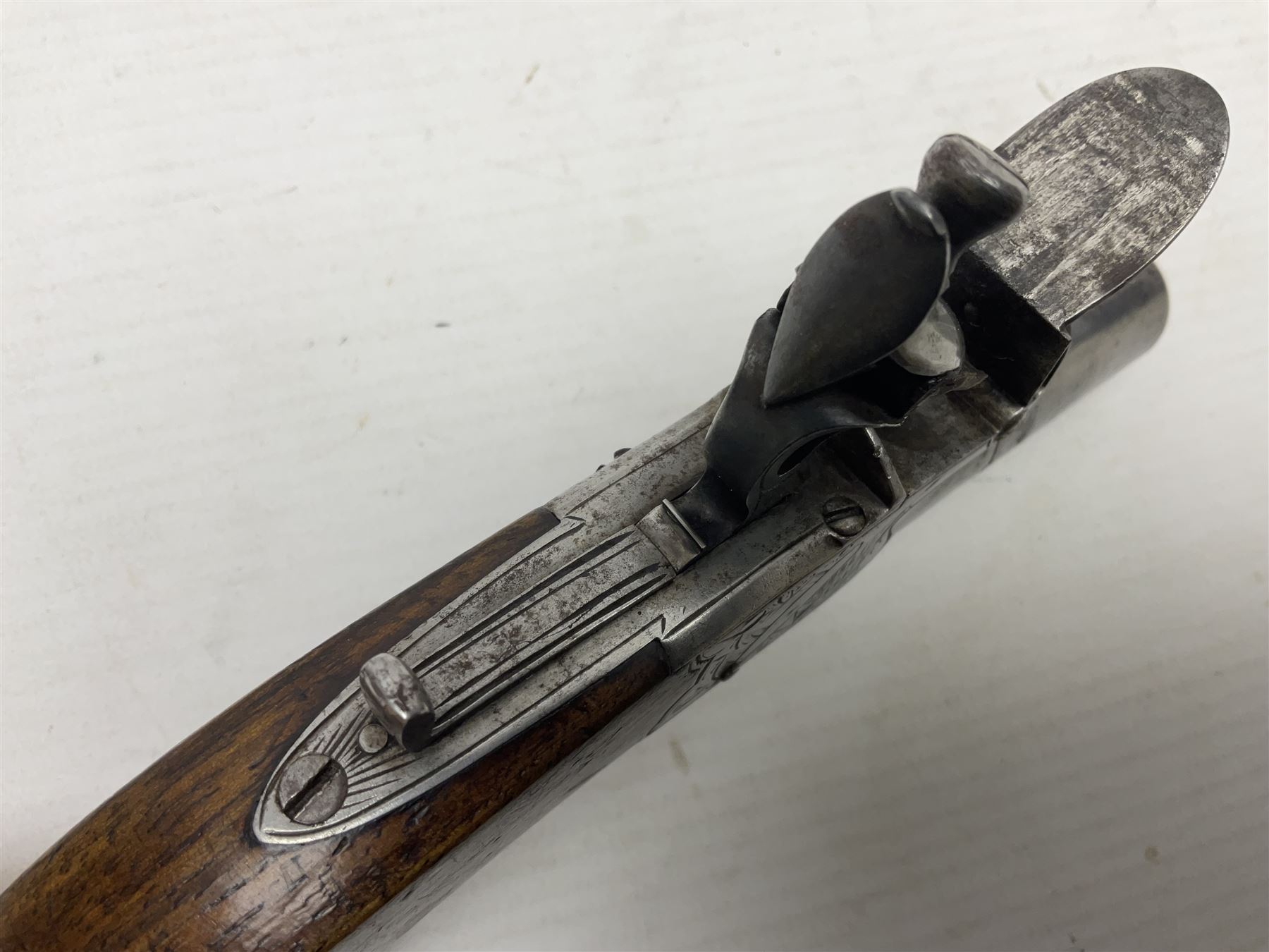Early 19th century J. Calvert (Leeds) flintlock single barrel tap action pocket pistol, approximately .45 cal., the 4cm (originally) screw off barrel with top safety and walnut stock L16cm overall