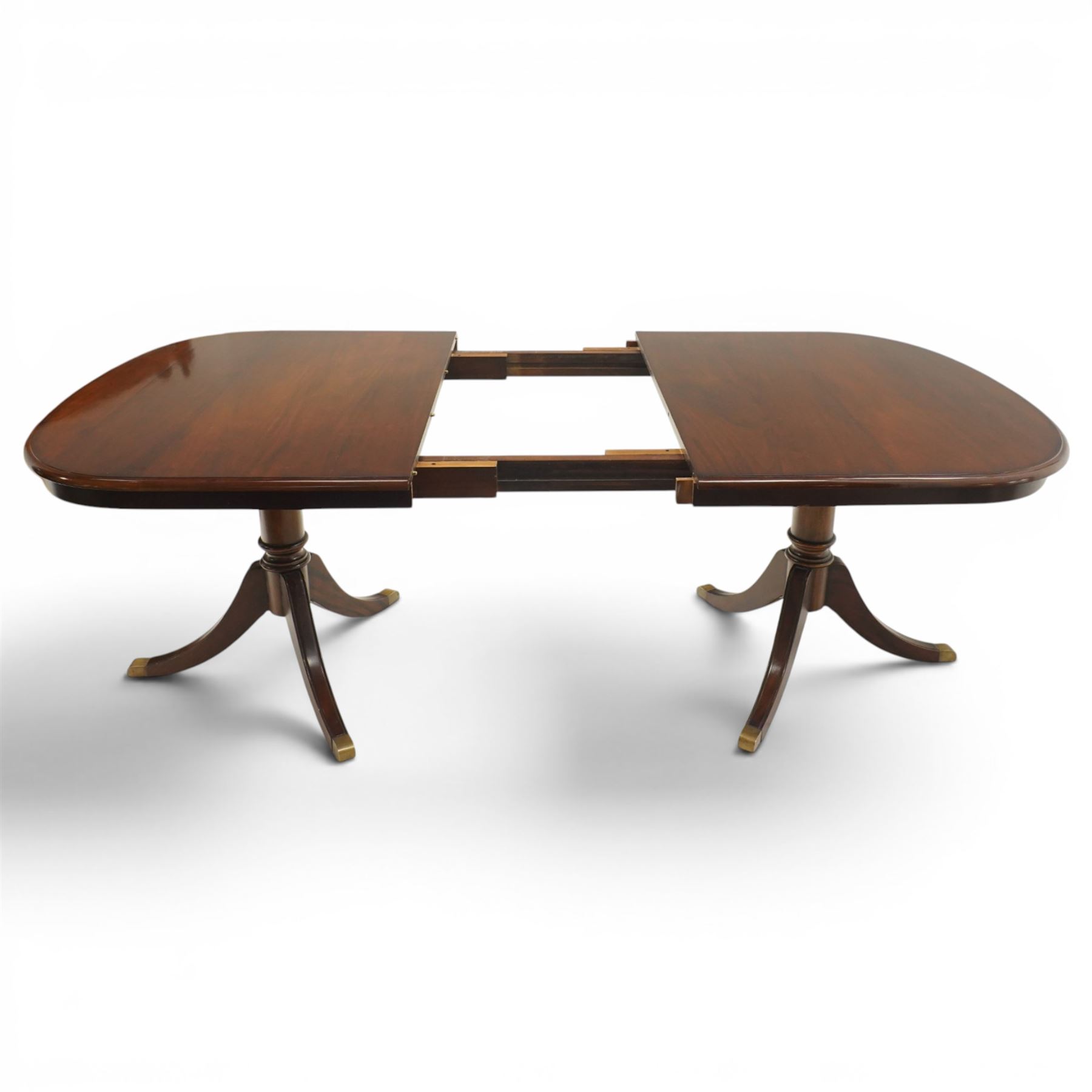 Georgian design mahogany twin pedestal extending dining table, rectangular rounded top on twin tripod pedestals with splayed supports, with additional leaf (W170cm D115cm H77cm); with set six (4+2) matching mahogany framed cameo-back dining chairs, upholstered in pale yellow lozenge patterned fabric (W57cm H94cm)