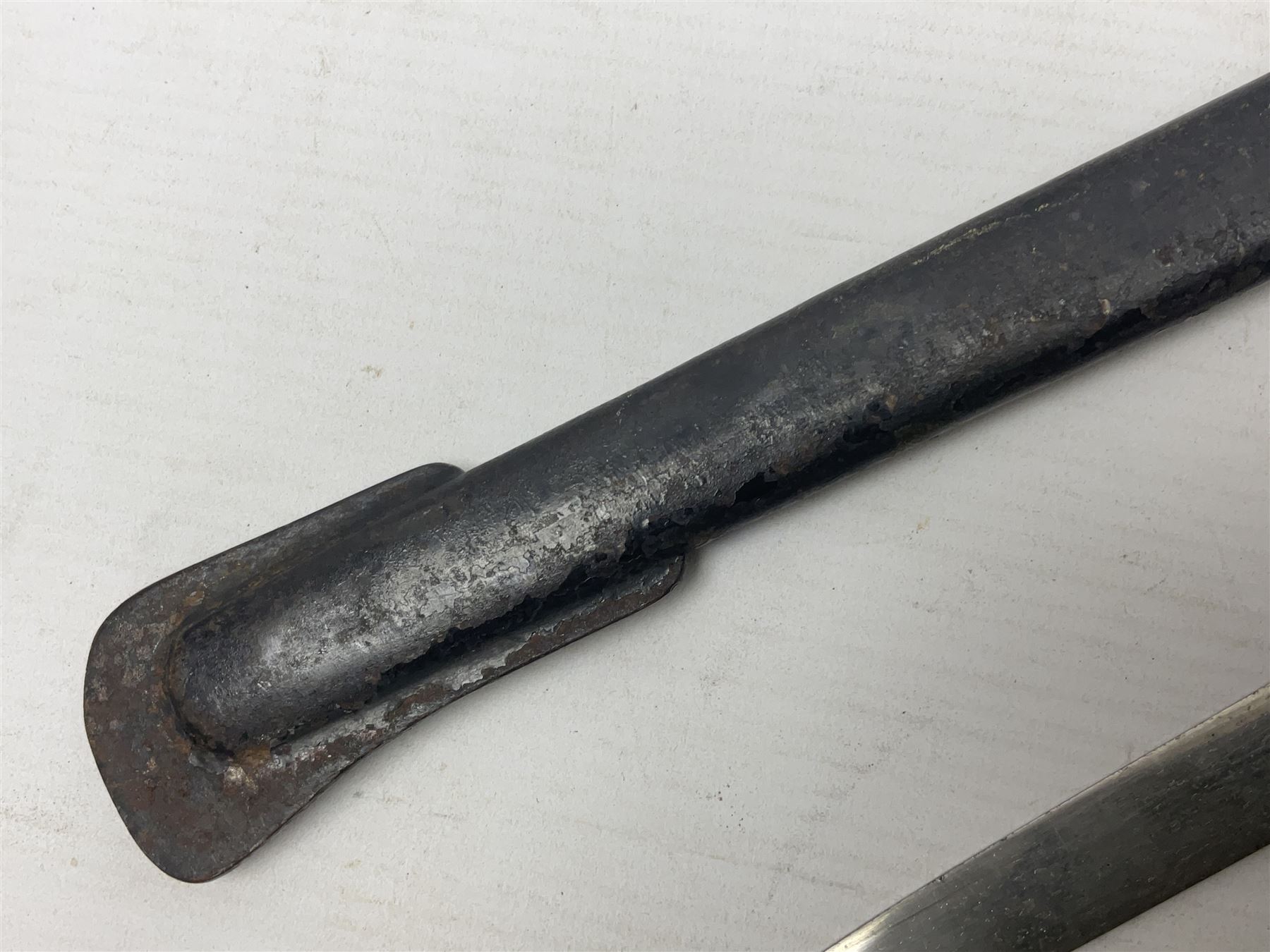 Prussian artillery officer's sword, with 80cm slightly curving fullered  blade, brass hilt with D-shaped langets, curving knucklebow, wire-bound black grip and leather finger loop; in black painted steel scabbard with single suspension loop
