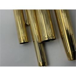 Sheaffer Triumph Imperial fountain pen, the gold plated barrel with fluted stripe design and gold nib stamped 14K 585, together with a Sheaffer Targa slimline fountain pen with gold plated barrel similarly decorated with gold nib stamped 14K 585, ballpoint pen and propelling pencil, each with a fluted gold plated barrel, largest L13.5cm (4)