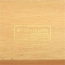 Austinsuite - mid 20th century teak headboard with bedside cabinets and matching  mirrored dressing table, the headboard with floating single drawer bedsides raised on a single tapering support, the dressing table with attached tilting mirror, above rectangular top with kneehole and two banks of two drawers, raised on tapering supports

Headboard H 84cm, D 40cm, W 229cm, W between bedsides 151cm 
Dressing table H 113cm D 44cm, W 149cm, H to underside of dresser 61cm