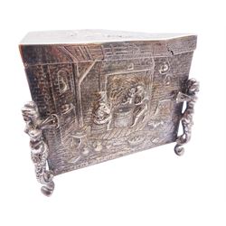 Late 19th century German Hanau silver mounted cigarette box, of rectangular form, the sides and cover repousse decorated with genre scenes, the cover edge engraved 'The Officers 3rd Batt East Yorkshire Regt from Colonel Brooke', opening to reveal a soft wood lined interior and gilding to underside of cover, the whole upon four feet modelled as Caryatids, with Hanau marks for Neresheimer, F import mark, and hallmarked Samuel Boyce (or Boaz) Landeck, Sheffield 1897, H10cm including feet W23cm D13cm