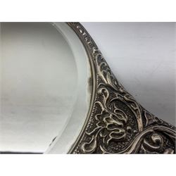 Silver mounted dressing table mirror, embossed with birds, masks, and foliate and C scrolls, hallmarked Birmingham, and fruit knife with mother of pearl handle and silver blade, (2)