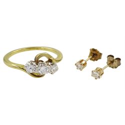 18ct gold three stone diamond ring, total diamond weight approx 0.20 carat and a pair of 9ct gold diamond stud earrings