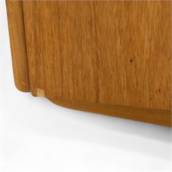 Sutcliffe of Todmorden - Mid 20th century teak highboard, ‘S-Form’ range, the upper section with glazed and panelled sliding doors above open shelving, over a base fitted with twin drawers and cupboards, all with moulded recessed handles, on shaped tapering supports, reflecting the sleek organic styling characteristic of 1960s British modern furniture design