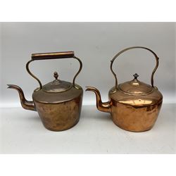 Quantity of copper to include six kettles, some examples with brass fixtures, Middle Eastern copper saucepan with lid, on three burner stand and copper jug in two boxes