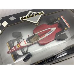 Three Paul's Model Art Grand Prix 1:18 scale die-cast racing cars - Williams Renault FW17 D. Hill; Ferrari 412 T1 J. Alesi; and Ligier Honda JS41 M. Brundle; all boxed (3)