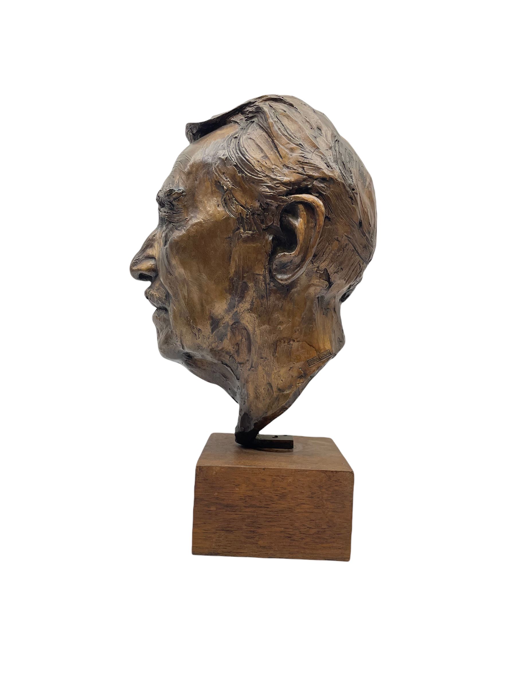 Anne Curry (French 1943-): Bronze bust modelled after the artist's late Grandfather, signed and dated '95 and numbered 1/5 on square wooden plinth, H41cm overall. Provenance: This piece was a gift from the artist's father to the vendors late mother in law. The portrait depicts the artist's late Grandfather who was a friend of the family