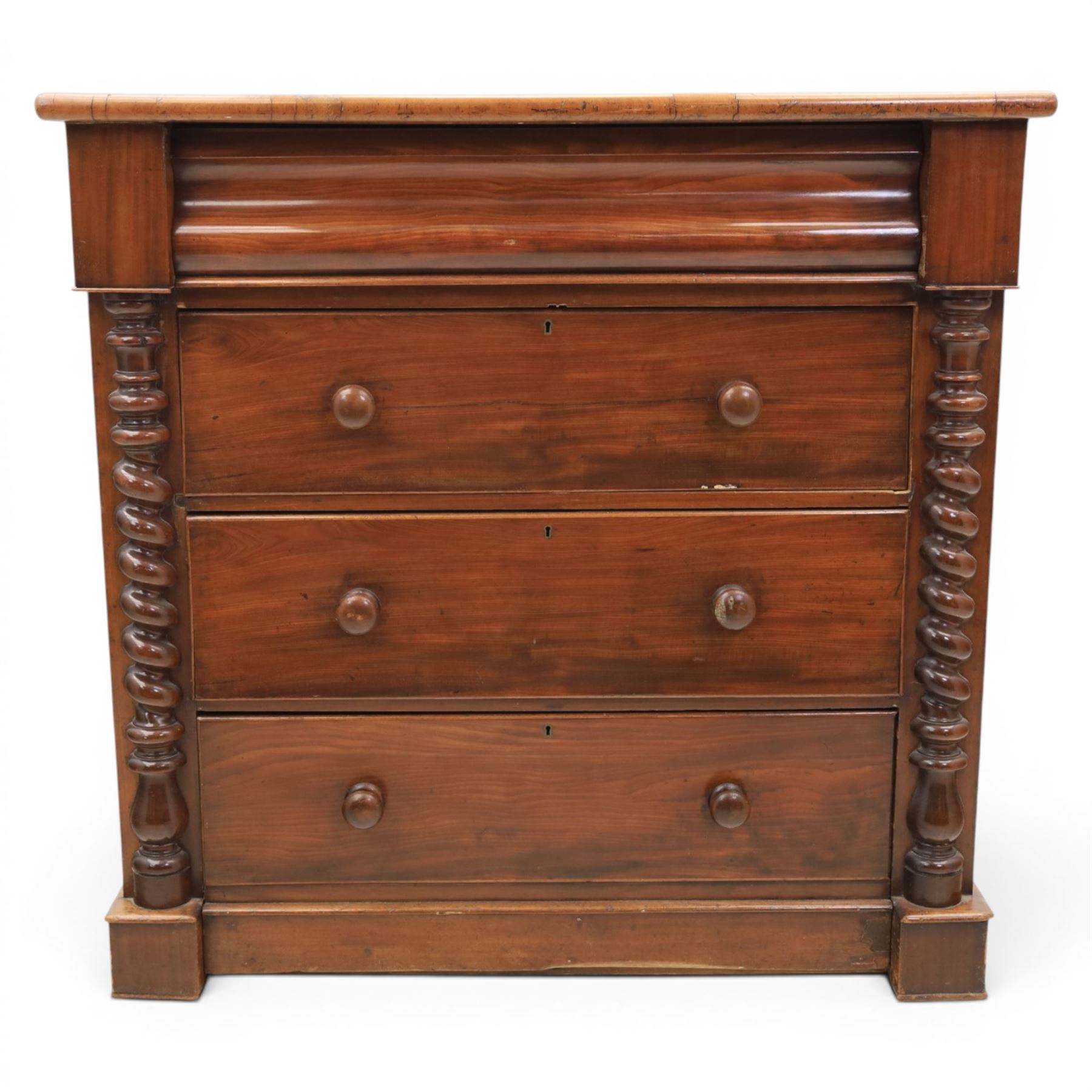 William IV style mahogany chest, rectangular moulded top over cushion-moulded frieze drawer and three long drawers with turned wooden handles, flanked by rope-twist turned pilasters, on plinth base