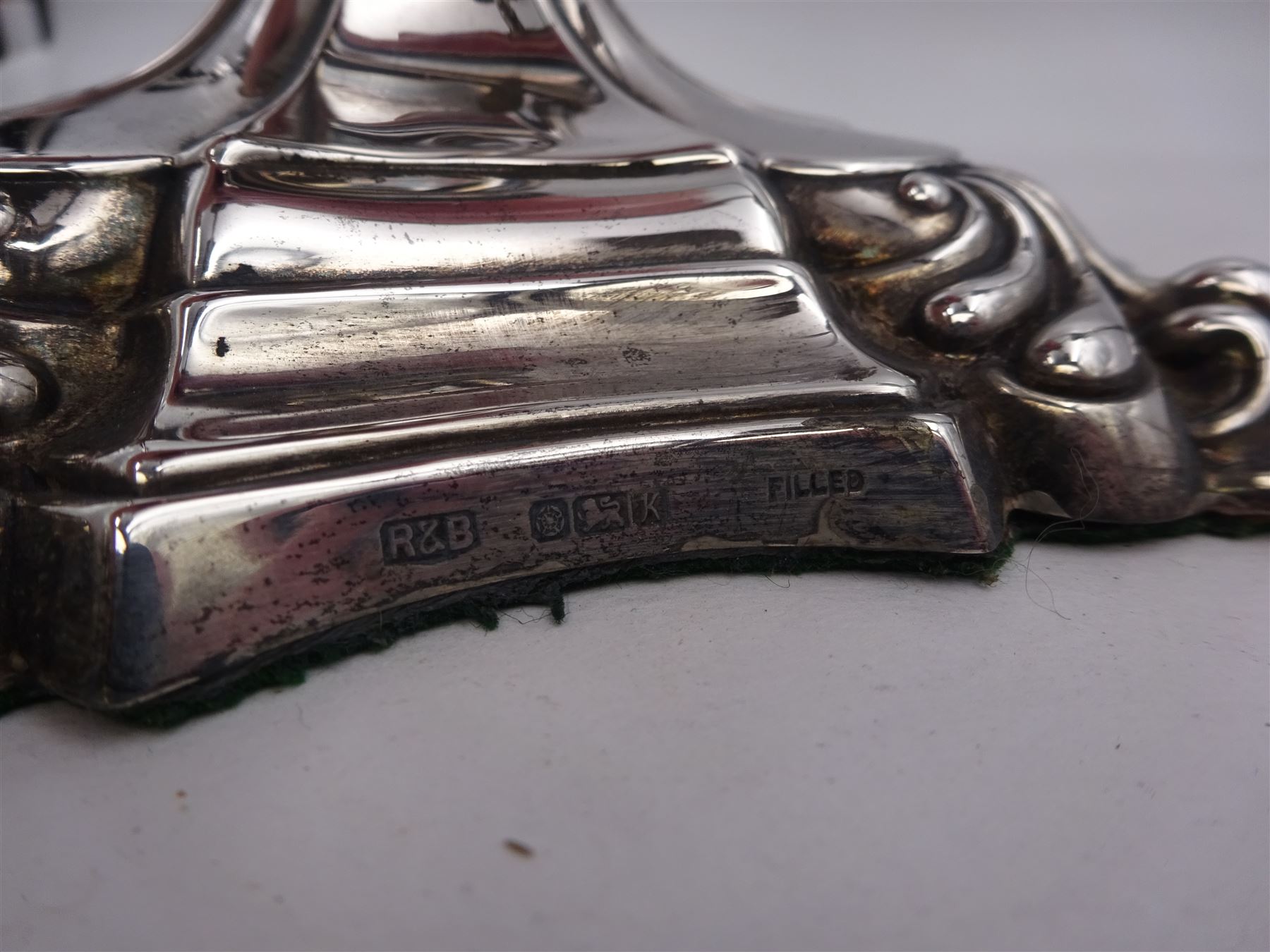 Modern silver five branch candelabra centrepiece, the four extending branches each with removable sconces, surrounding a central candle holder, upon a knopped stem and weighted stepped square foot, with anthemion to each corner, hallmarked Roberts & Belk, Sheffield 1984, H36cm 