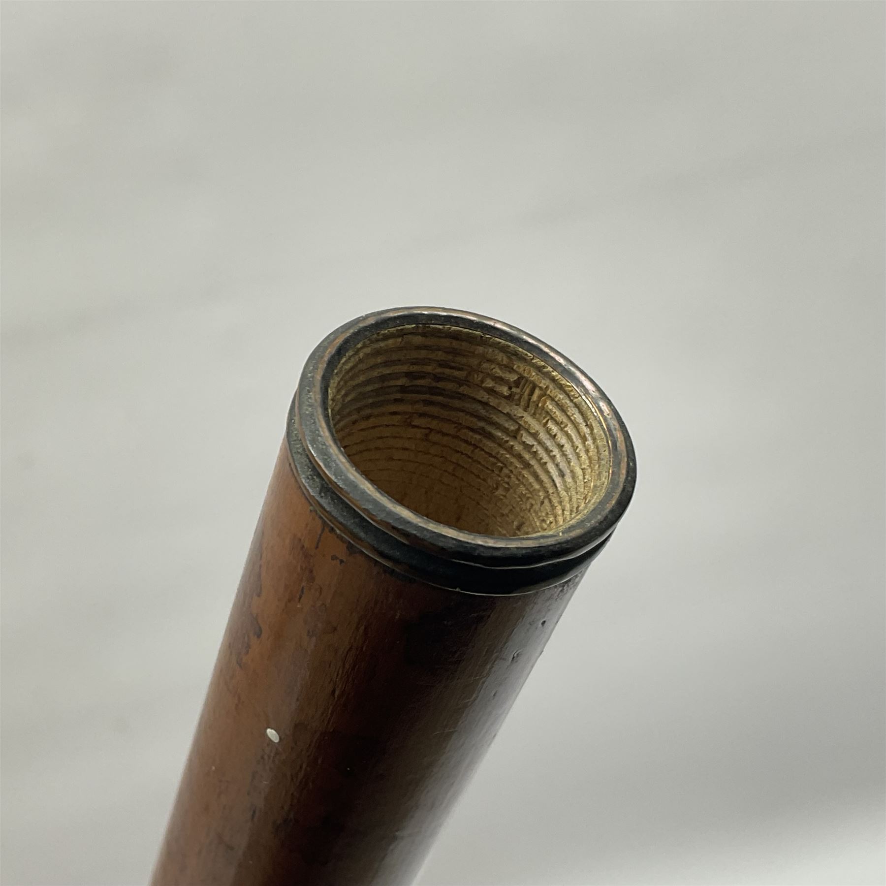 19th century malacca walking cane, the screw threaded domed cover opening to reveal vacant recess, above a further screw threaded opening revealing a removable glass vial with stopper, glass vial L41cm, cane L89.5cm