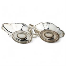 Pair of silver sauce boats with crimped reeded rims, angular handle and on pedestal foot Birmingham 1916 Maker Gorham Manufacturing Co.