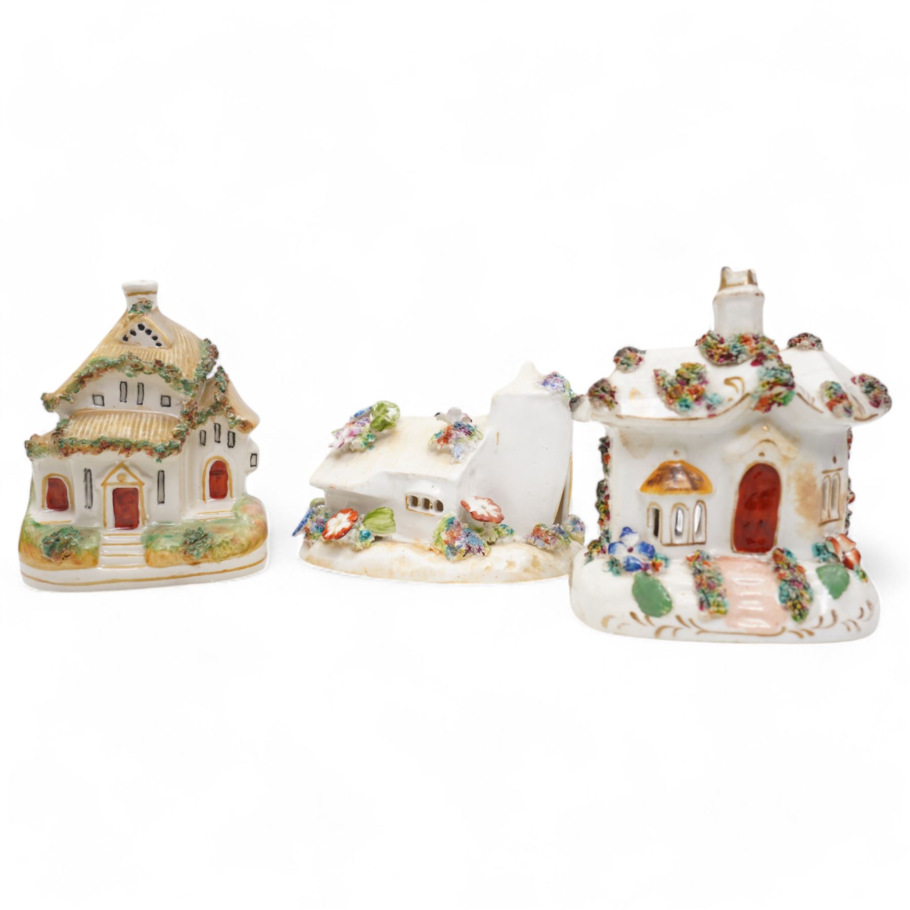 19th century pottery money box in the form of a two storey house with applied floral decoration W14cm  and six pottery cottage pastille burners