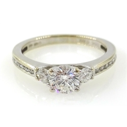  Three stone round brilliant cut diamond 18ct white gold ring, with diamond set shoulders hallmarked diamonds 0.69 carat  