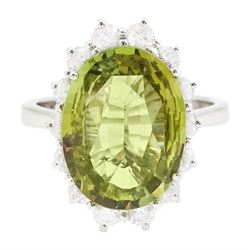 18ct white gold alexandrite and diamond cluster ring, the natural oval cut green alexandri...