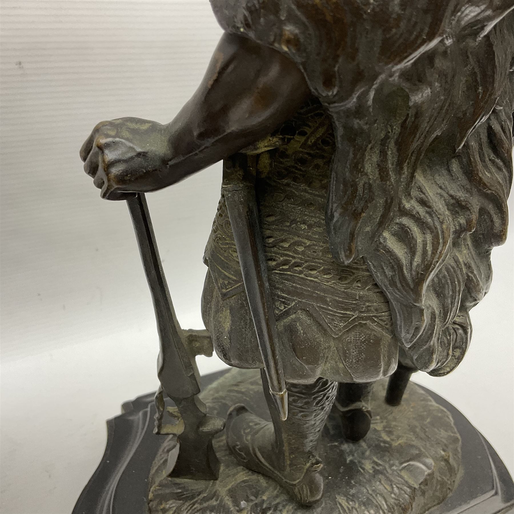 Pair of bronzed figure modelled as a hunter in traditional dress, each holding a pike, H48cm