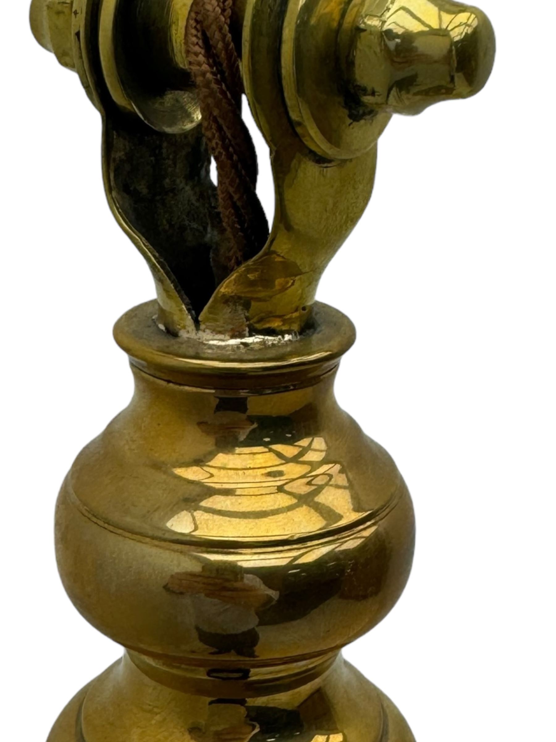 Early 20th century brass adjustable floor lamp, Royal Doulton decorative ceramic base embellished with raised floral and scroll patterns, stamped, brass column and adjustable arms terminating in brass bulb holder