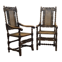  Pair Carolean style oak armchairs, cresting rail relief carved with putti holding crown, barley twist uprights with acanthus carved down swept arms with scrolled terminals, cane work back and seat, carved peg feet, W60cm  