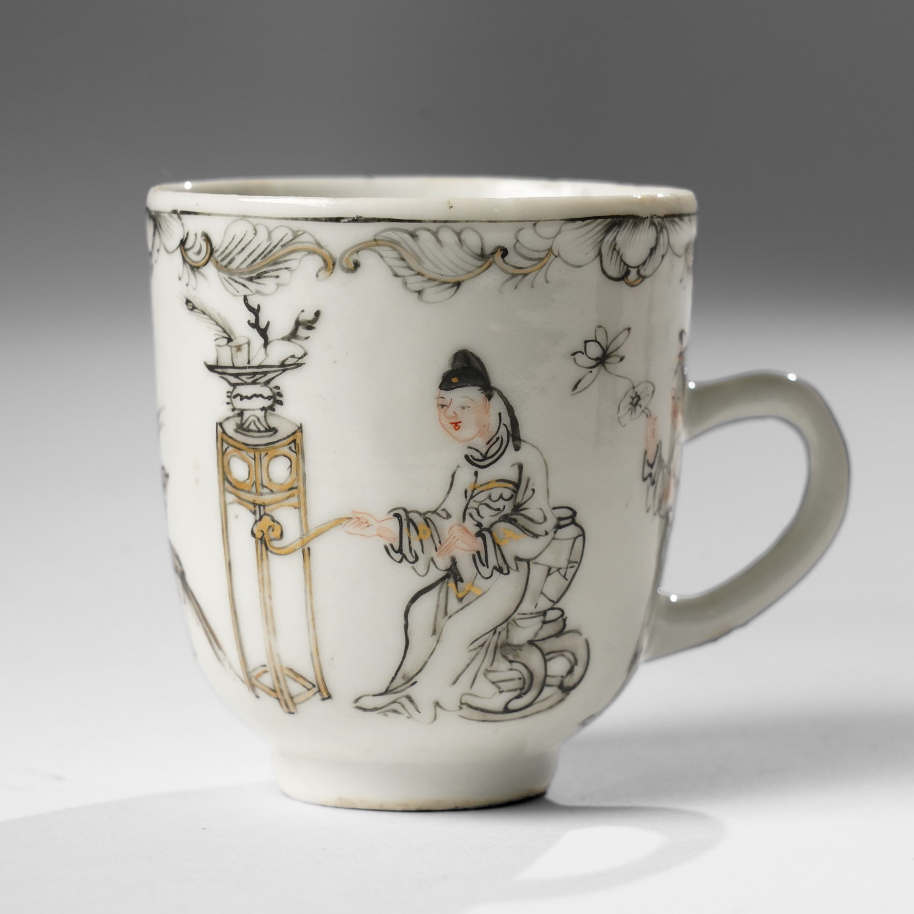 Chinese Yongzheng period coffee cups and saucer, painted in grisaille with figures in traditional landscapes and heightened in gilt (3)