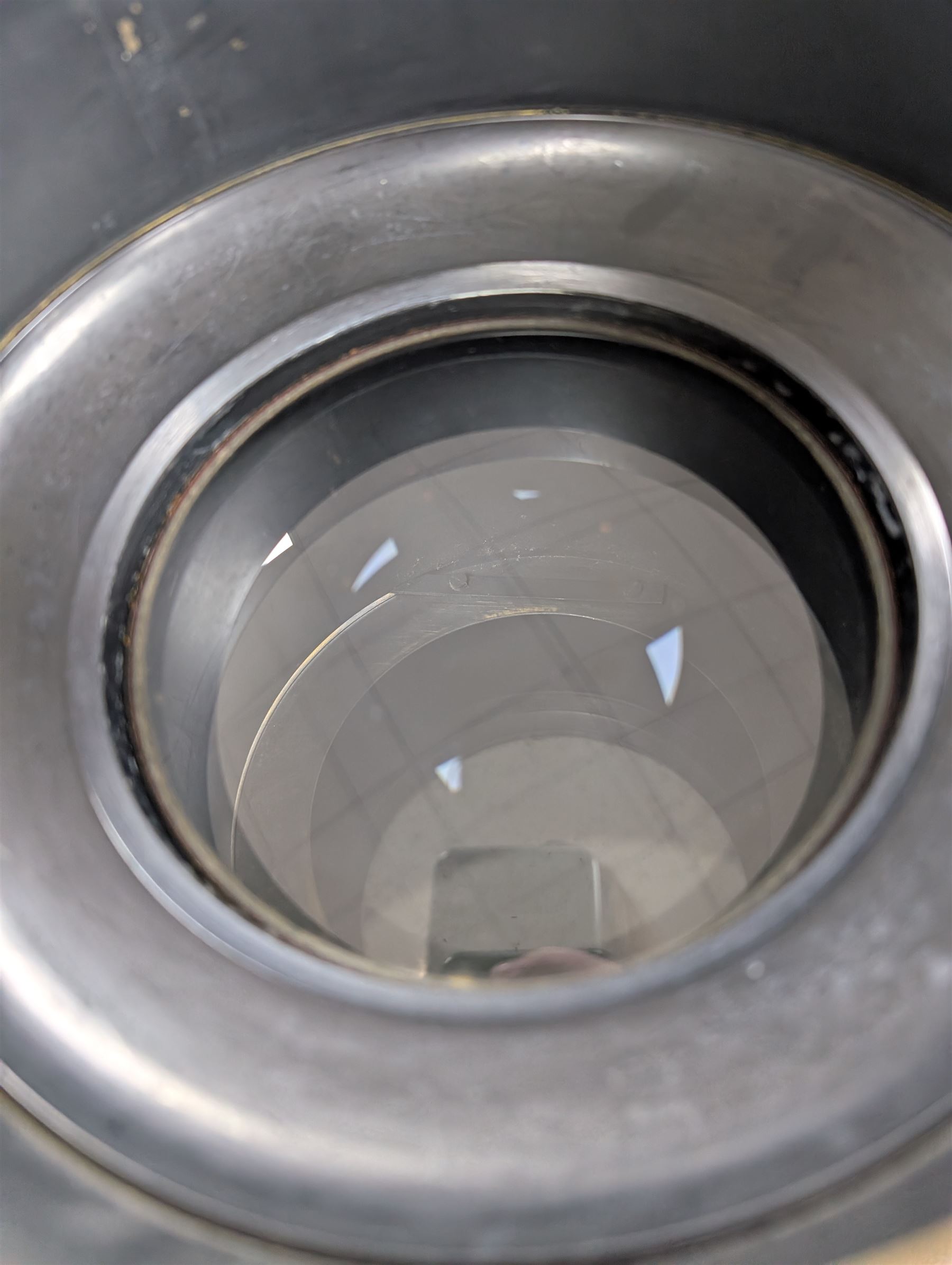 Late 19th century Voigtlander & Sohn large brass Euryscop lens no. 8 serial no. 31590, mounted to long black wooden box, with leather lens cover and seven brass Waterhouse stops, lens case D19cm