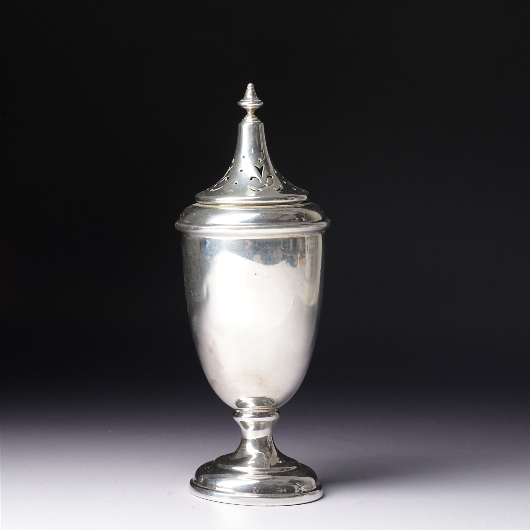 Silver vase shape sugar caster with pierced cover on pedestal foot Birmingham 1945 Maker S Blanckensee & Co Ltd