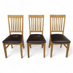 Contemporary set of six light oak dining chairs with faux leather cushion seats 