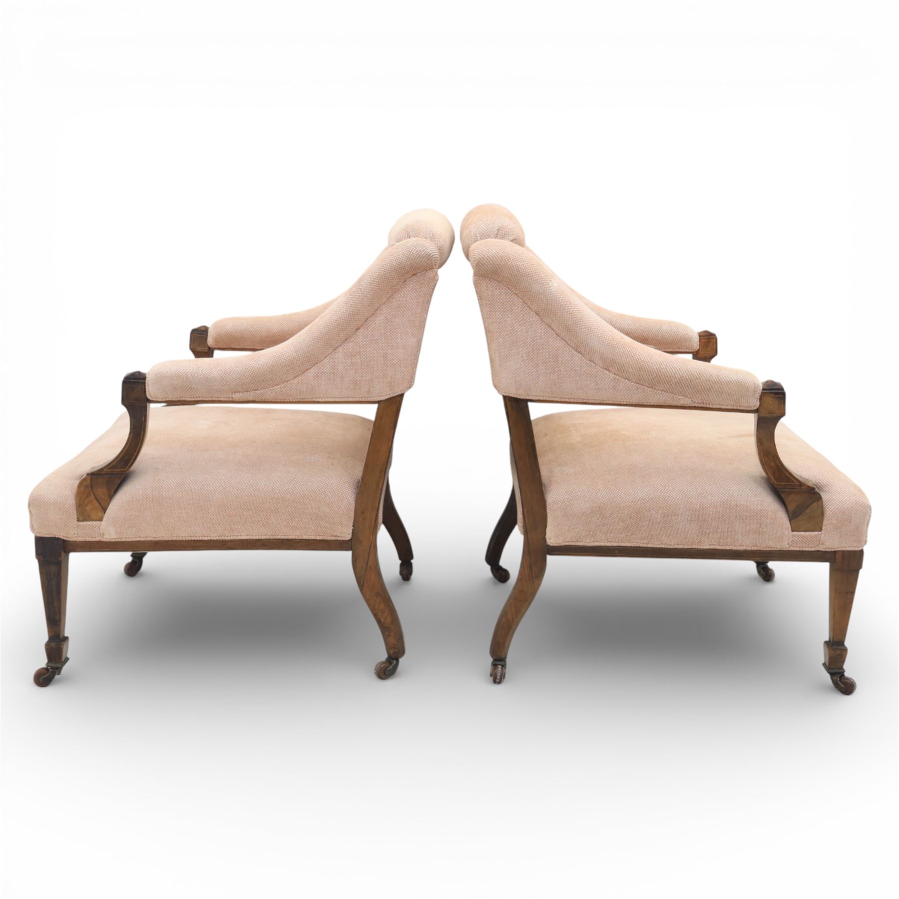 Quality Edwardian seven piece inlaid salon suite, comprising three seater settee, pair of arm chairs and four chairs with pierced splat backs, upholstered in pale pink fabric, inlaid with flowering urns, upon tapering legs with spade feet and castors