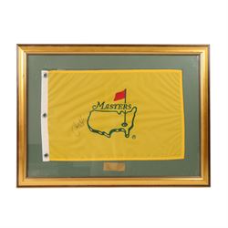 Signed golf memorabilia, to include 1988 US Masters Champion Augusta National flag, signed by Sandy Lyle, a golfing glove signed by Nick Faldo, two signed 2002 Ryder Cup prints, 1979 Masters scorecard signed by Fuzzy Zoeller displayed with a 1980 Masters scorecard signed by Seve Ballesteros, all framed, largest frame H60cm