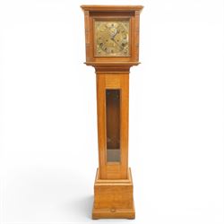 Mouseman - mid-20th century oak longcase clock, with a high quality weight driven movement and dial by Sinclair and Harding & Co of Cheltenham, the rectangular hood carved with foliate ornament, over a glazed and oak trunk on stepped base, with carved mouse signature, by the workshop of Robert Thompson of Kilburn Provenance: purchased directly from the Kilburn workshop in the 1940s/1950s