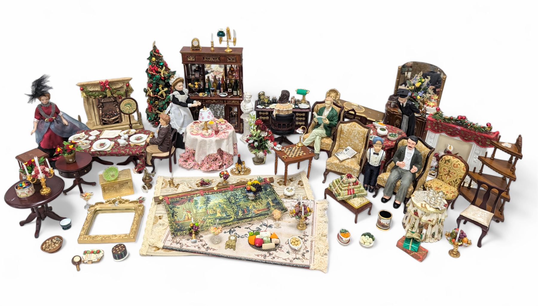 Dolls house living room and dining room furniture, including arm chairs, desk, fireplaces, dressers, tables, eight figures and a large collection of predominantly Christmas themed food, accessories and decorations