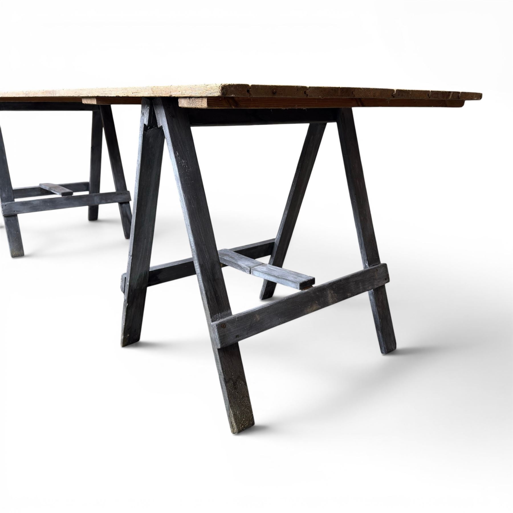 Vintage wooden plank trestle table, on two painted folding stands