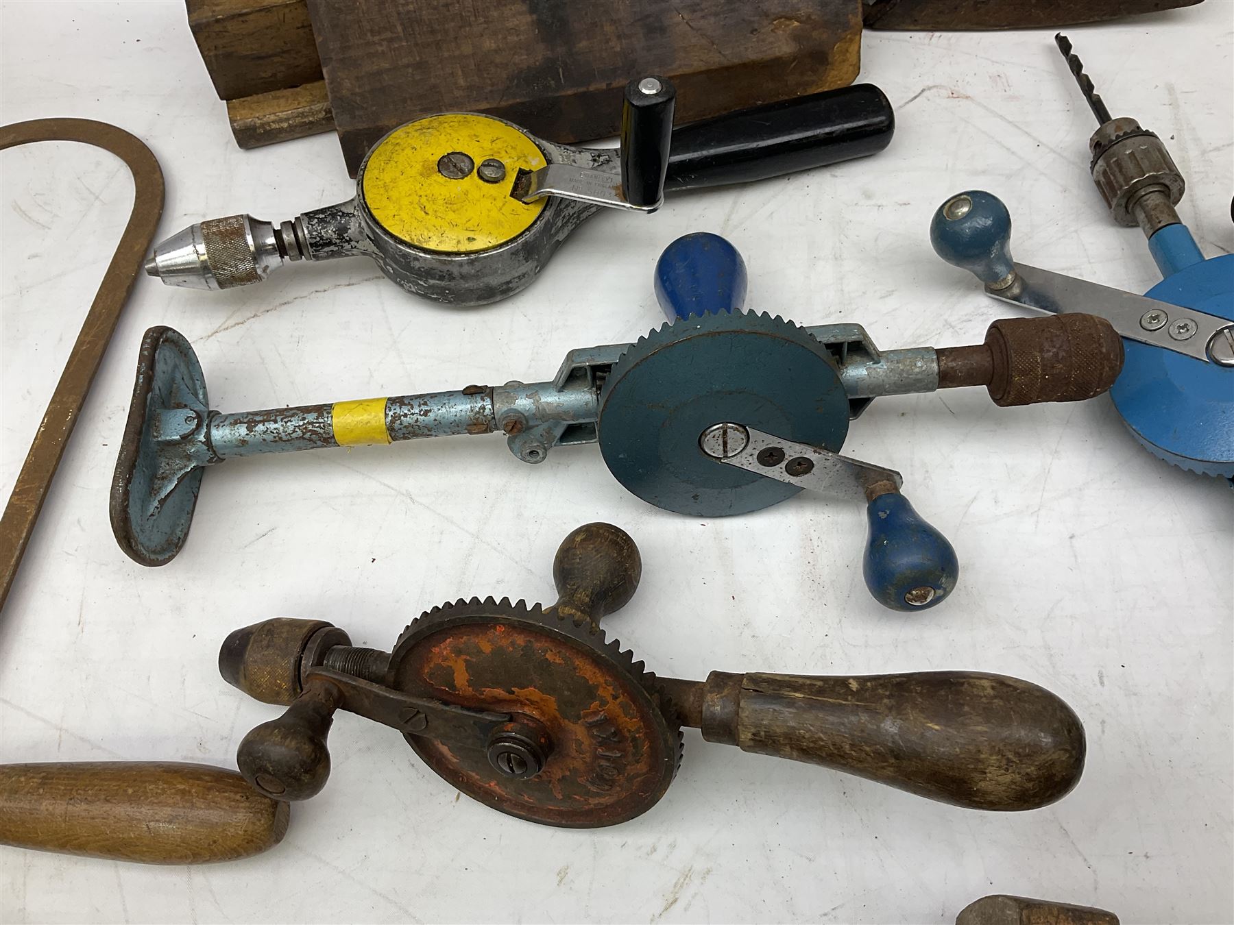 Quantity of woodworking tools, comprising hand drills to include Stanley No. 803 and No. 5803, Qualcast Clipper etc, together with collection of planes to include moulding examples and rebate plane of stepped form, and further tools including chisels etc