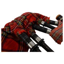 Set of mid 20th century bagpipes, with McLeod chanter, Royal Stuart cover, tassels, ribbons and spare accessories, contained within a wooden carry case, together with a Scarborough Highland Pipe Band uniform, comprising black highland dress jacket, Royal Stuart kilt, Glen Garry hat, Swinging Six sporren, Sgian Dubh knife, piper's dirk with knife and fork, etc