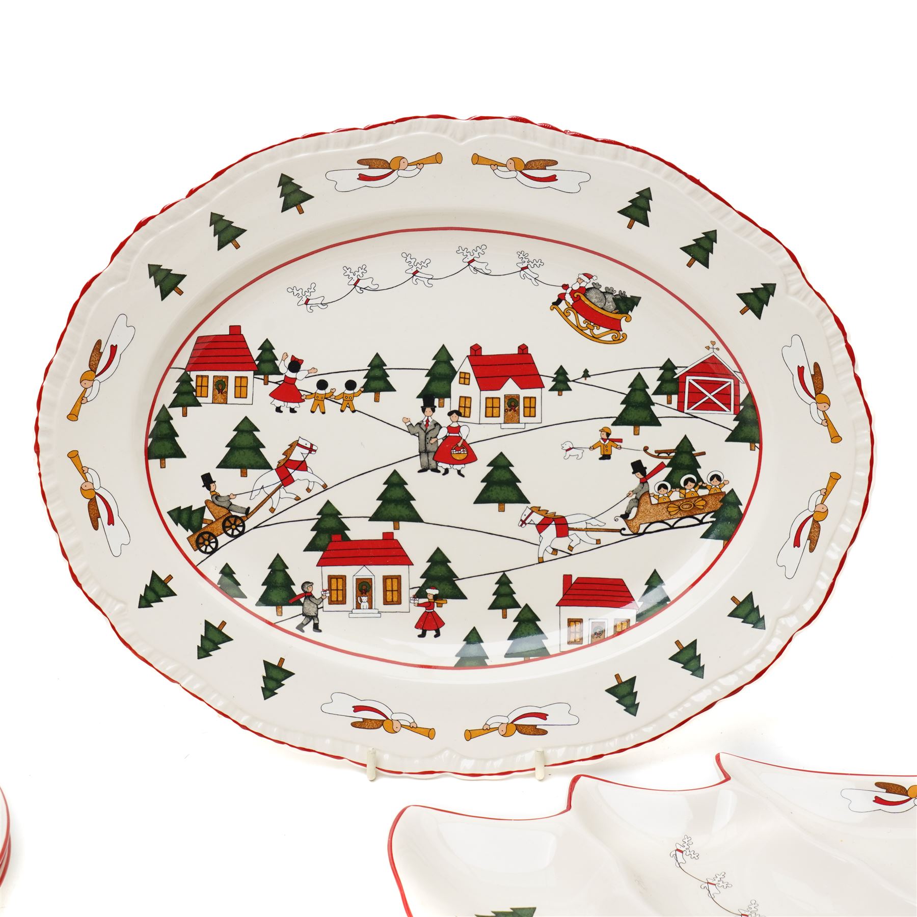Masons Christmas Village dinner wares, designed by Marsten-Mandrajji, comprising three dinner plates, four lunch plates, tree shaped bon bon dish, serving platter, cake stand, napkin rings etc