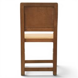 Mouseman - oak panel back carver armchair, with commemorative back panel engraved 'In memory of Fiona Mary Fotheringham Born 5th June 1958 Died 14th July 1965', above tan seat with brass studded trim, with carved Mouse signature, by Robert Thompson's of Kilburn