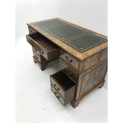Late 20th century elm twin pedestal desk, rectangular moulded top with green leather inset, fitted with eight drawers, W122cm, H78cm, D59cm