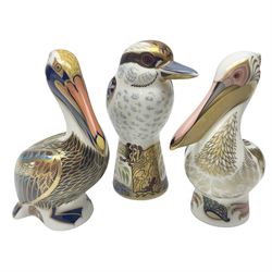 Three Royal Crown Derby paperweights, comprising Kookaburra, White Pelican and Brown Pelican, all with gold stopper, printed mark beneath and original box