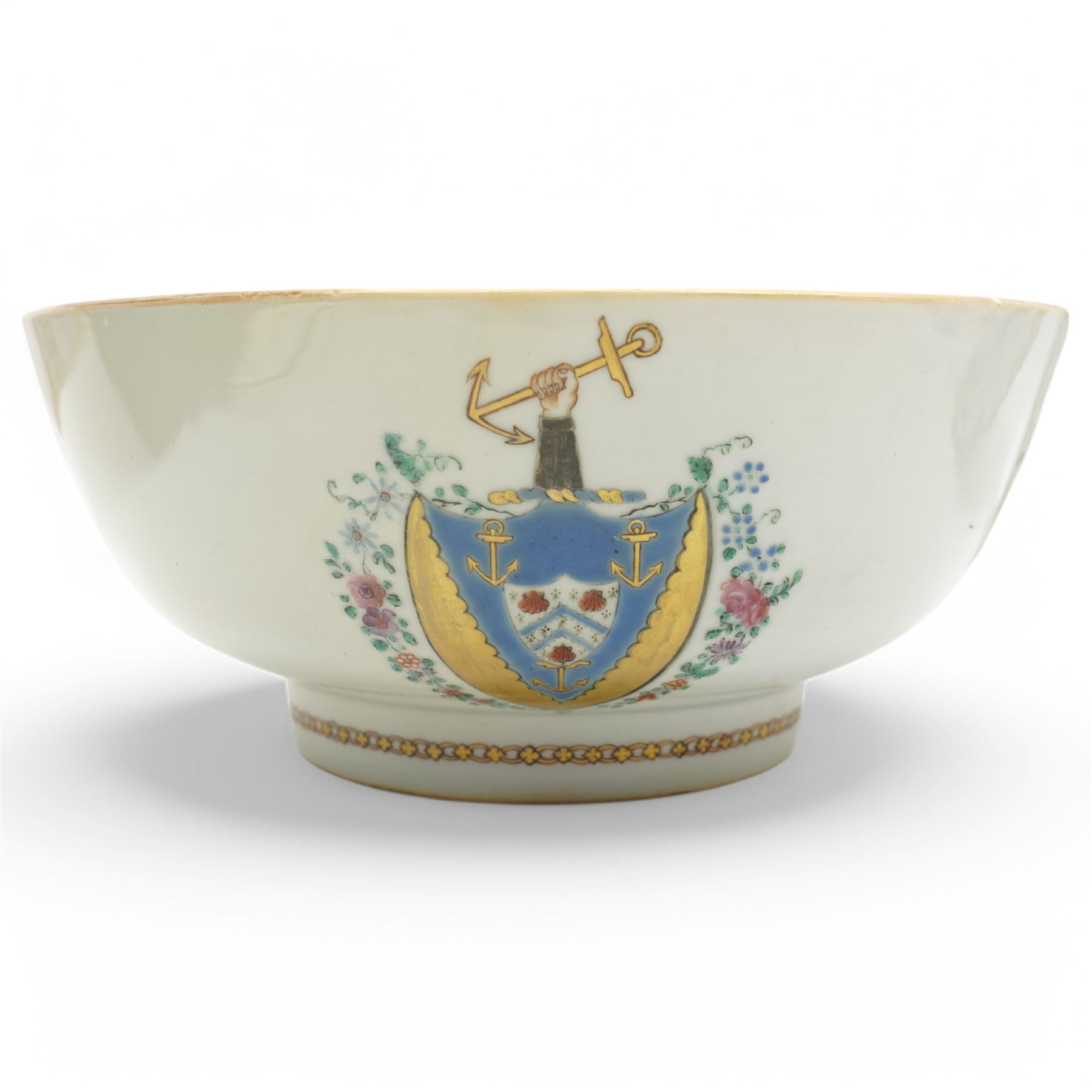 Chinese export Armorial part service decorated with sprays of flowers and a crest of an arm holding an anchor comprising bowl D23cm, pair of octagonal plates 16cm and sparrow beak jug H12cm (4)