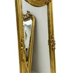 Pair of Italian Baroque design gilt wall hanging mirrors, interlaced foliate C-scroll pediment with extending foliage, the upper section decorated with female mask within a floral ribbon border, moulded frame with scrolled foliage brackets, bevelled mirror plate 